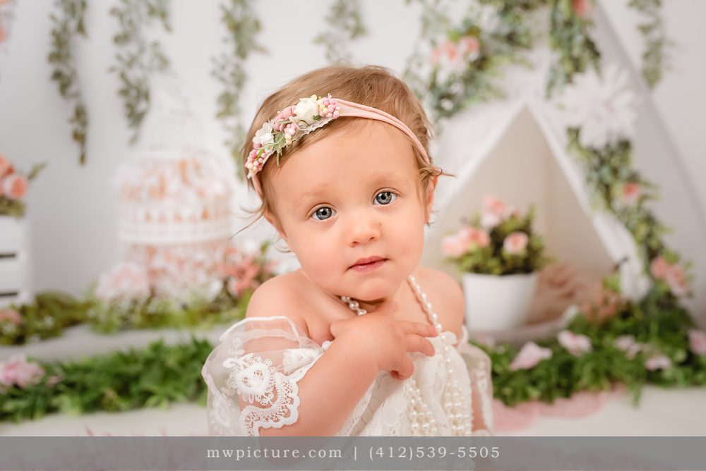 Decorated Wall in the Back and A Child at Photo Session