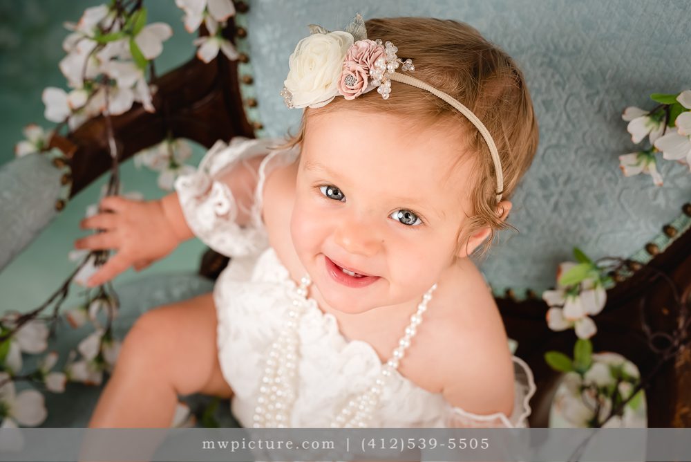 A Little Girl Sitting on Chair at Birthday Photo Session
