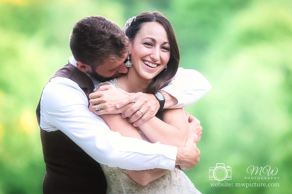 A Couple Holding Each Other at Wedding Session