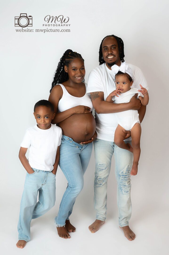 A family of four posing for the camera.