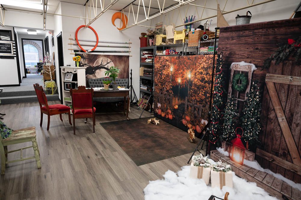 A room with many pictures on the wall